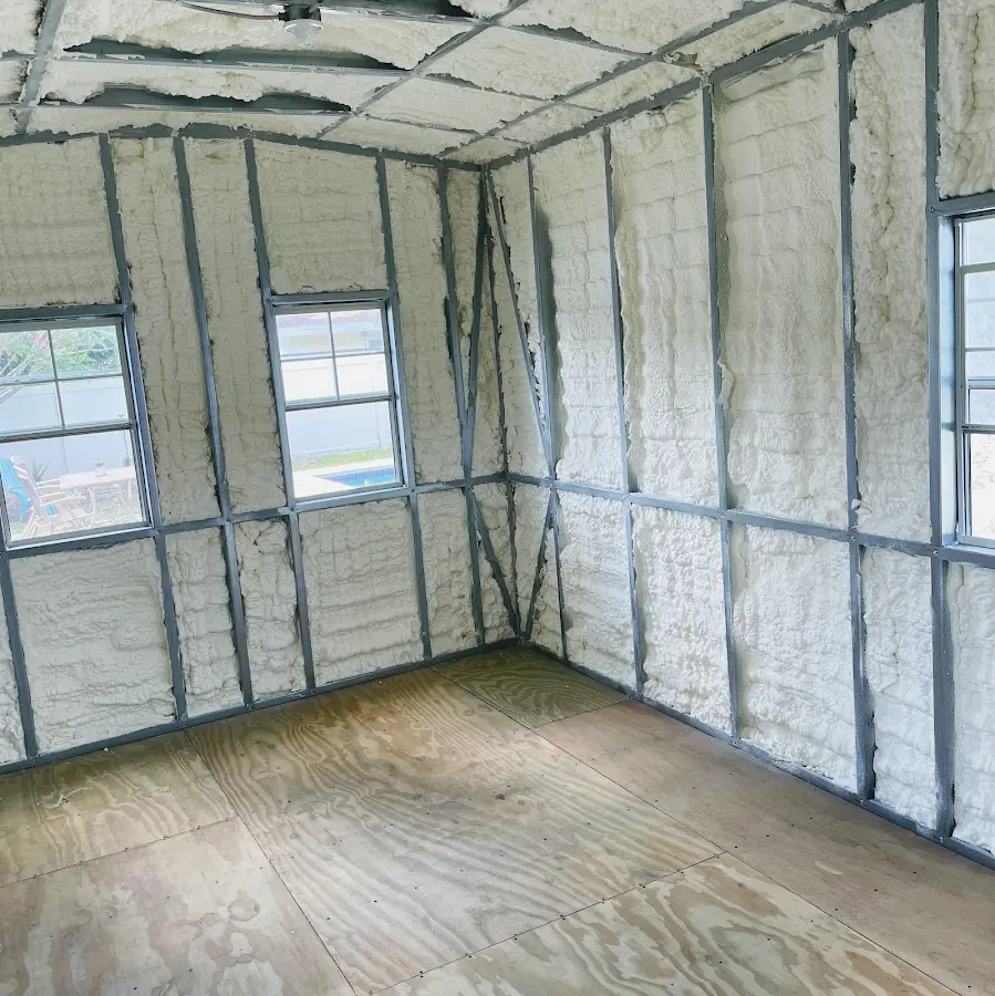 Closed-cell spray foam insulation applied to wall cavities in a residential project in Dania Beach